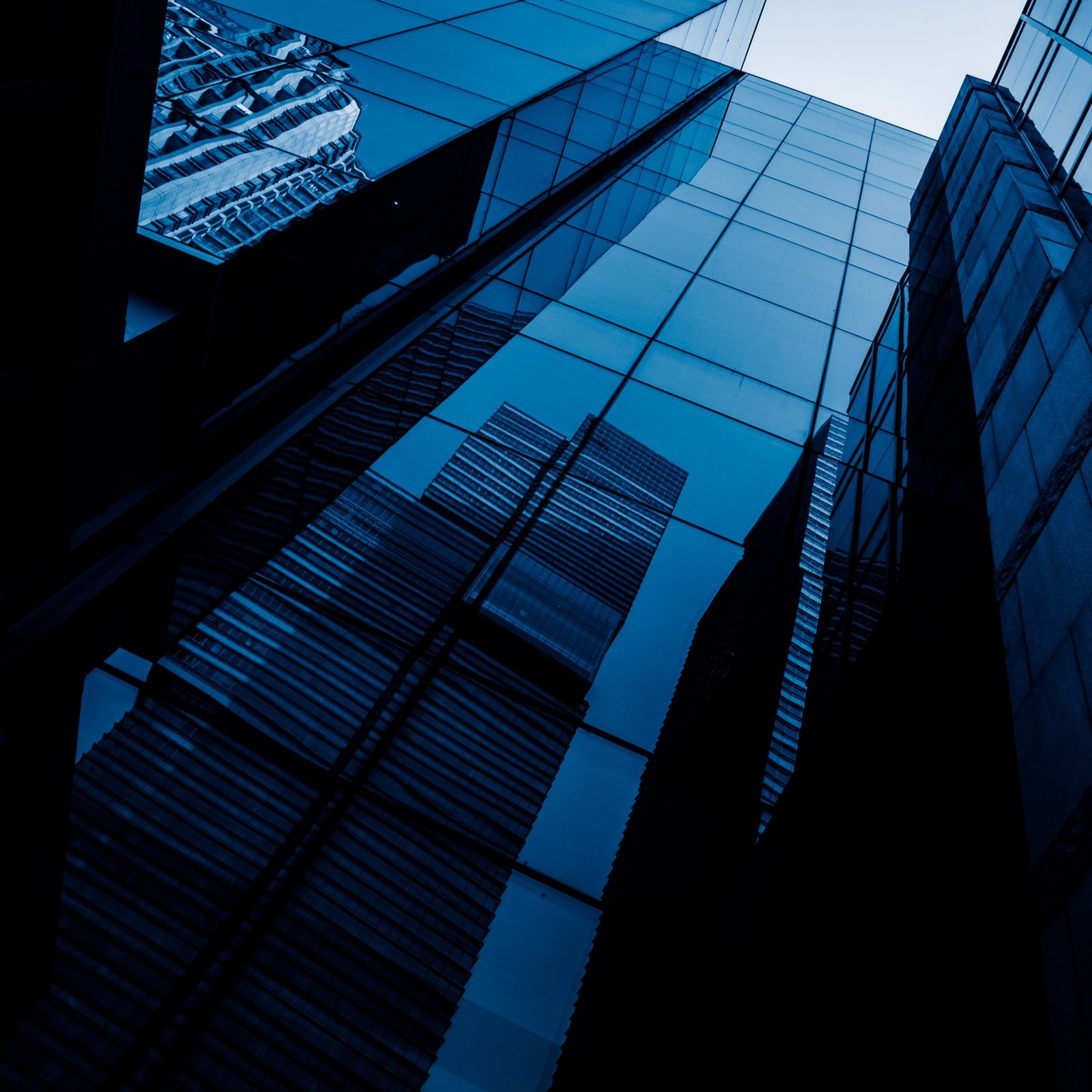 Looking up at a glass office tower